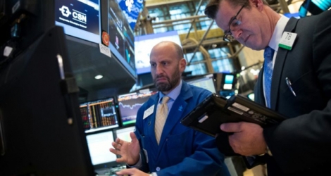 Traders sur le parquet du New York Stock Exchange le 18 mai 2017 