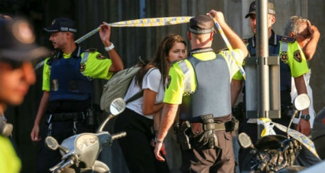 Cordon de police près du site d'un attentat, le 17 août 2017 à Barcelone