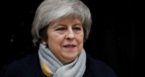 La Première ministre britannique Theresa May quitte le 10,Downing Street le 15 janvier 2019 avant que les députés britanniques ne votent sur l'accord de divorce conclu avec l'Union européenne