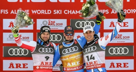 Le podium du super-G des Mondiaux de ski à Are en Suède, le 6 février 2019 (de g. à d.): le Français Johan Clarey (2e), l'Italien Dominik Paris (1er) et l'Autrichien Vincent Kriechmayr (2e ex-aequo).