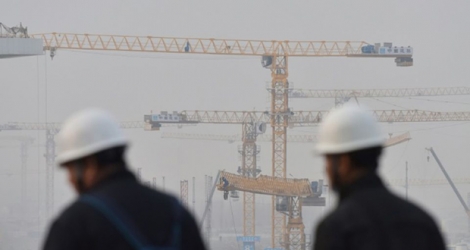 Des ouvriers sur le chantier du nouvel aéroport de Pékin-Daxing, le 1er mars 2019.