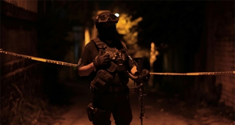 Des policiers en faction après une attaque menée lors d'une fête à Minatitlan, dans l'Etat de Veracruz au Mexique, le 19 avril 2019.