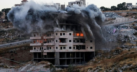 Destruction à l'explosif par Israël d'une maison dans le quartier palestinien de Sour Baher, le 22 juillet 2019, une opération condamnée par l'ONU, la France et l'UE.