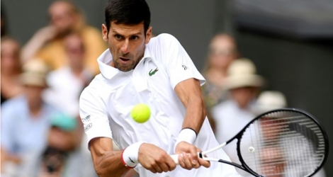 Le Serbe Novak Djokovic lors de sa victoire en finale de Wimbledon, le 14 juillet 2019 Photo Laurence Griffiths. AFP