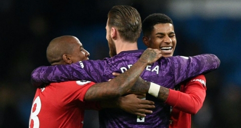 La joie des joueurs de Manchester United Ashley Young, David De Gea et Marcus Rashford après le succès chez Manchester City, le 7 décembre 2019.