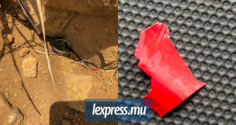 Le rocher que la mystérieuse voiture rouge a heurté, à Moka, laissant des traces rouges et même des morceaux de tôle (ci-contre).